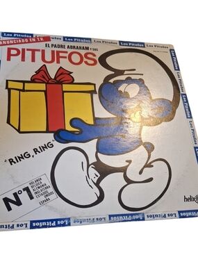 Helix Blue and White Smurf Figure with Yellow & Red Gift Graphic